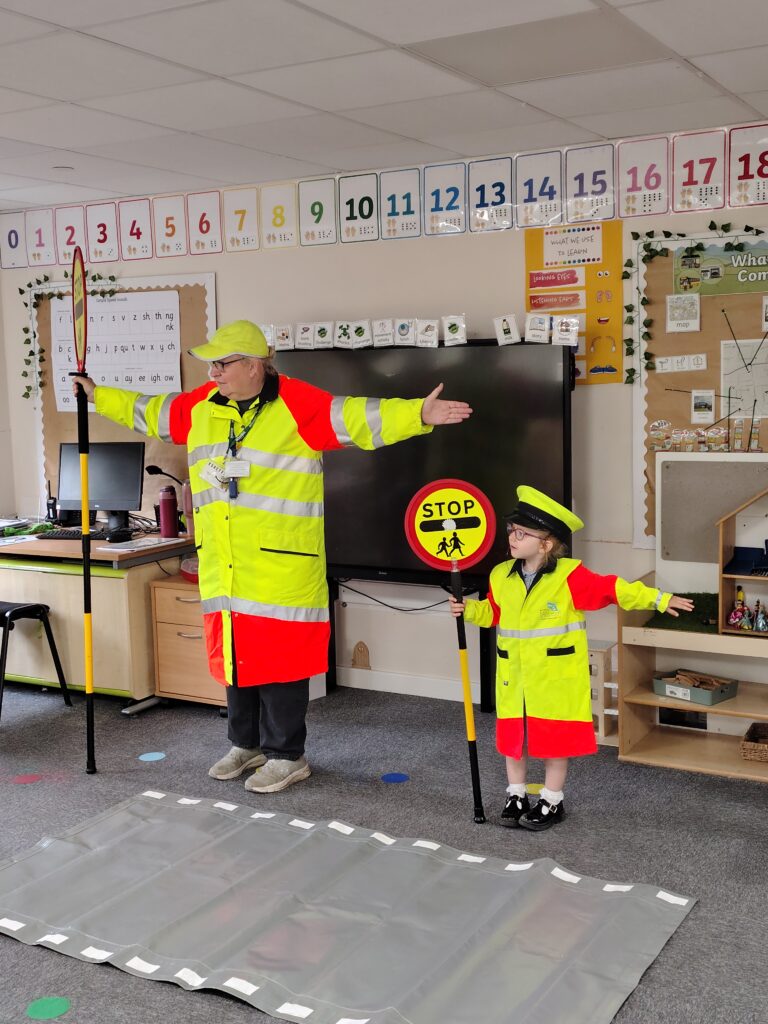 Woodlands Primary School pupil Isabella helps in school crossing patrol demonstration
