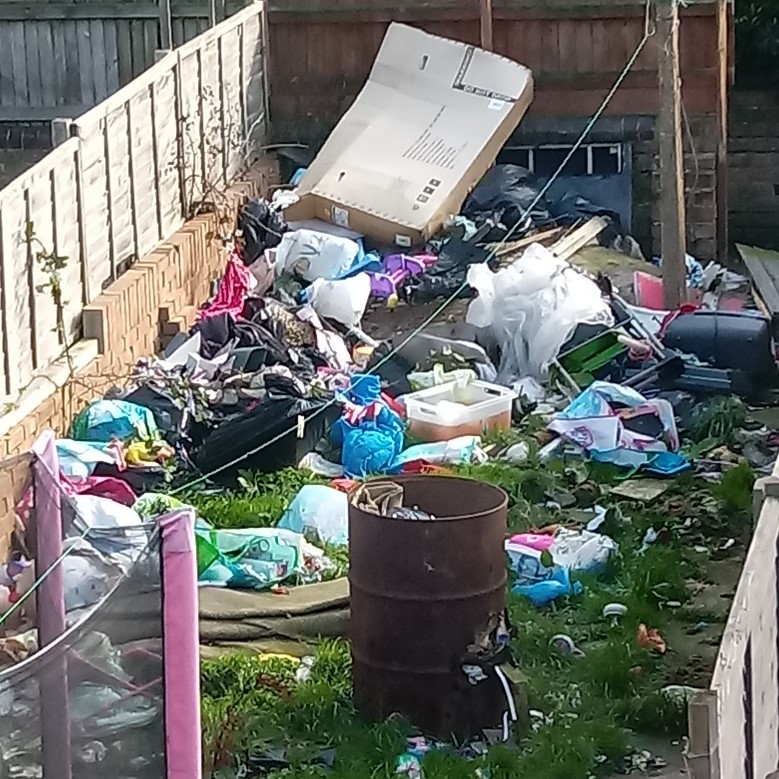 Rubbish piled up in the back garden of the Stanley Street home.