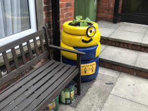 A one-eyed 'Binion' character made of recycled tyres in the garden at the Cambridge Street Hostel.